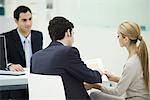 Professional meeting with clients, couple analyzing document together