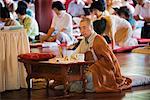 Monk and Worshippers at Bongeunsa Temple, Seoul, South Korea