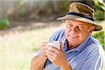 Portrait of Man Outdoors, Drinking Coffee
