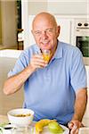 Portrait of Man Eating Breakfast