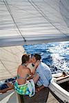 Couple kissing on sailboat