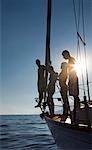 Two couples on sailboat sunset