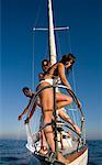 Group on sailboat standing