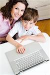 Woman and son looking up with laptop
