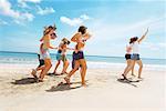 Group having a race on the beach