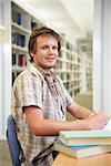 Portrait of young man in library