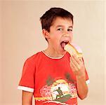 Child eating iced bun