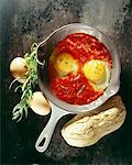Fried eggs with crushed tomatoes