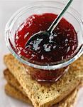 Pot of raspberry jam and toast