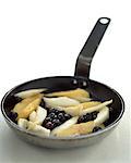 fruit cooking in frying pan