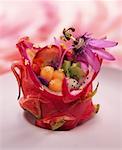 Mixed fruit salad with passionfruit flowers and served in a pitahaya