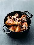 chicken with sesame seeds and dried figs roast in a casserole dish