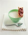 bowl of hot milk and toast with rhubarb jam