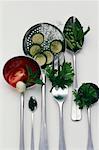 Herbs and vegetables on utensils