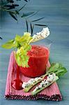 Tomato gaspacho and branches of celery coated with fromage frais