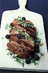 Roast beef with bacon,thyme in flower and blackberries