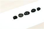 Five black stones in a line