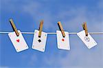 Playing Cards Pinned to Clothesline