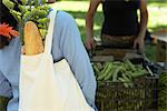 Shopper Approaching Vegetable Vendor at Farmer's Market