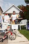 Woman Selling Items at a Garage Sale
