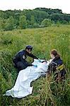Police Officers with Woman's Body in Field, Toronto, Ontario, Canada