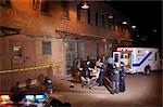 Paramedics with Injured Man by Ambulance and Crowd, Toronto, Ontario, Canada