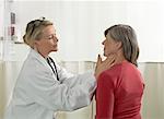 Doctor examining mature woman