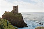 Woman Standing on Cliff by Dun an Oir Castle, Cape Clear Island, County Cork, Ireland