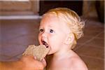 Baby Eating Piece of Bread