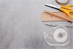 Close-up of Tape, Ruler, Pencil, Scissors, Utility Knife, and String