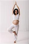 Pregnant woman practicing yoga