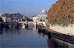 Italy, Rome, San Angelo Bridge on the Tiber River and Saint Peter's dome