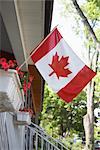 Canadian Flag Flying From Porch