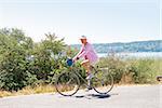 Woman riding a bicycle, Washington State, USA