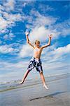 Junge jumping on the Beach, Washington State, USA