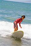 Girl surfing in the sea