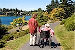 Man assisting his disabled mother in a wheelchair