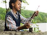 A boy doing an experiment on a plant