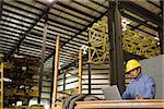 Man in warehouse with laptop