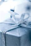 Christmas gift with silver ribbon, close-up