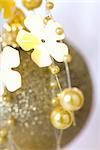 Decorative garland and gold Christmas ornament, close-up