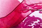 Magenta fabric and ribbon, extreme close-up