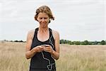 Woman runner listening to music