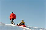 Father and Child Tobogganing, Salzburger Land, Austria