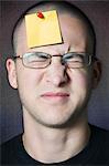 Teenager With Blank Note Pinned to his Head