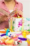 Woman Reading Birthday Card at Party