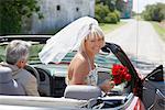 Bride Getting into Convertible