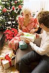 Couple Exchanging Gifts on Christmas Morning