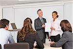 Lecturer handing student a certificate