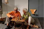 Senior couple playing chess